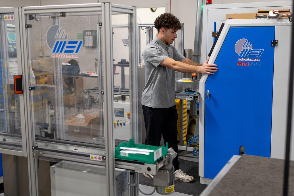 Technician loading the MEI 641 edging cell