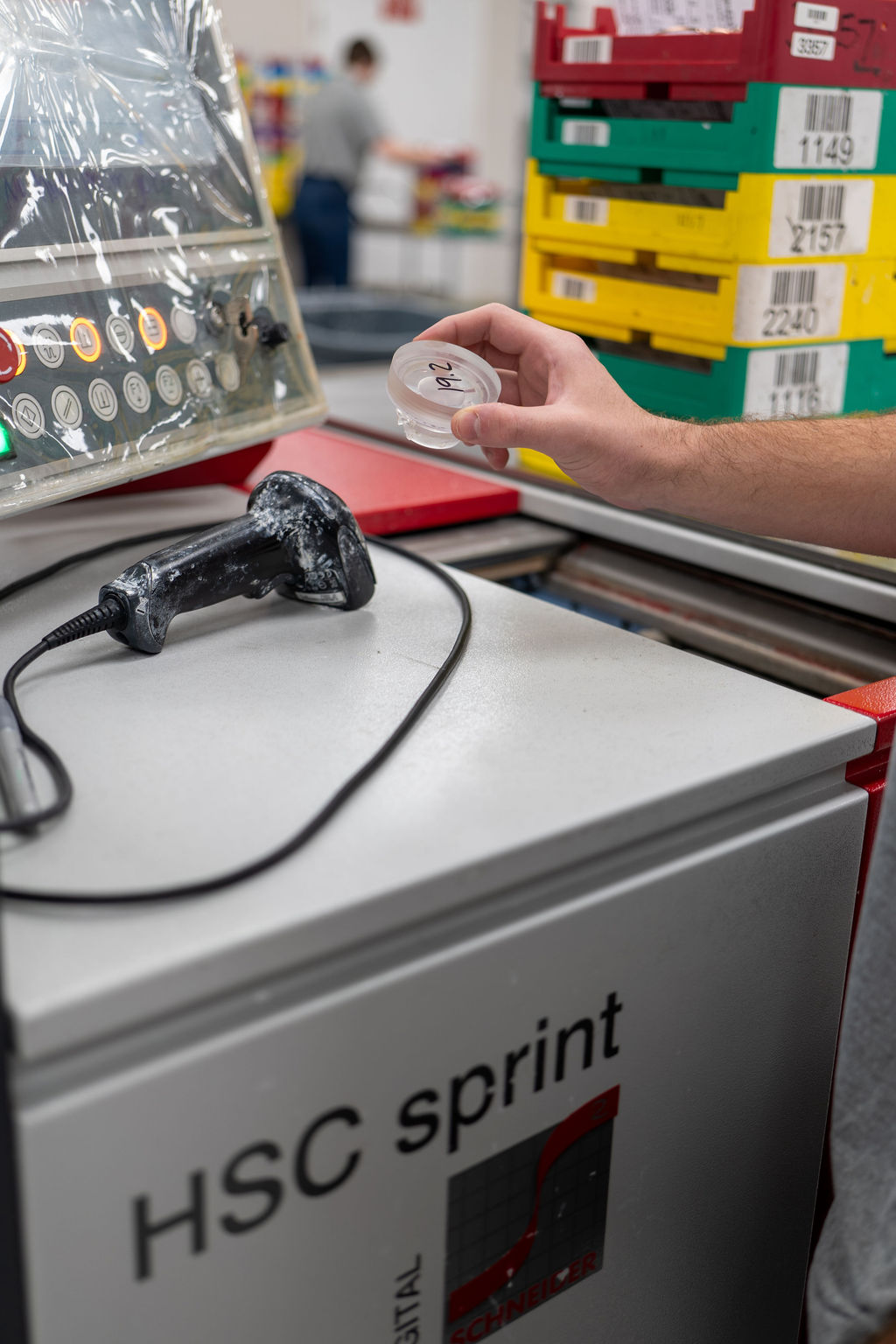 Tech inspecting a free-form lens from the Schneider HSC Sprint